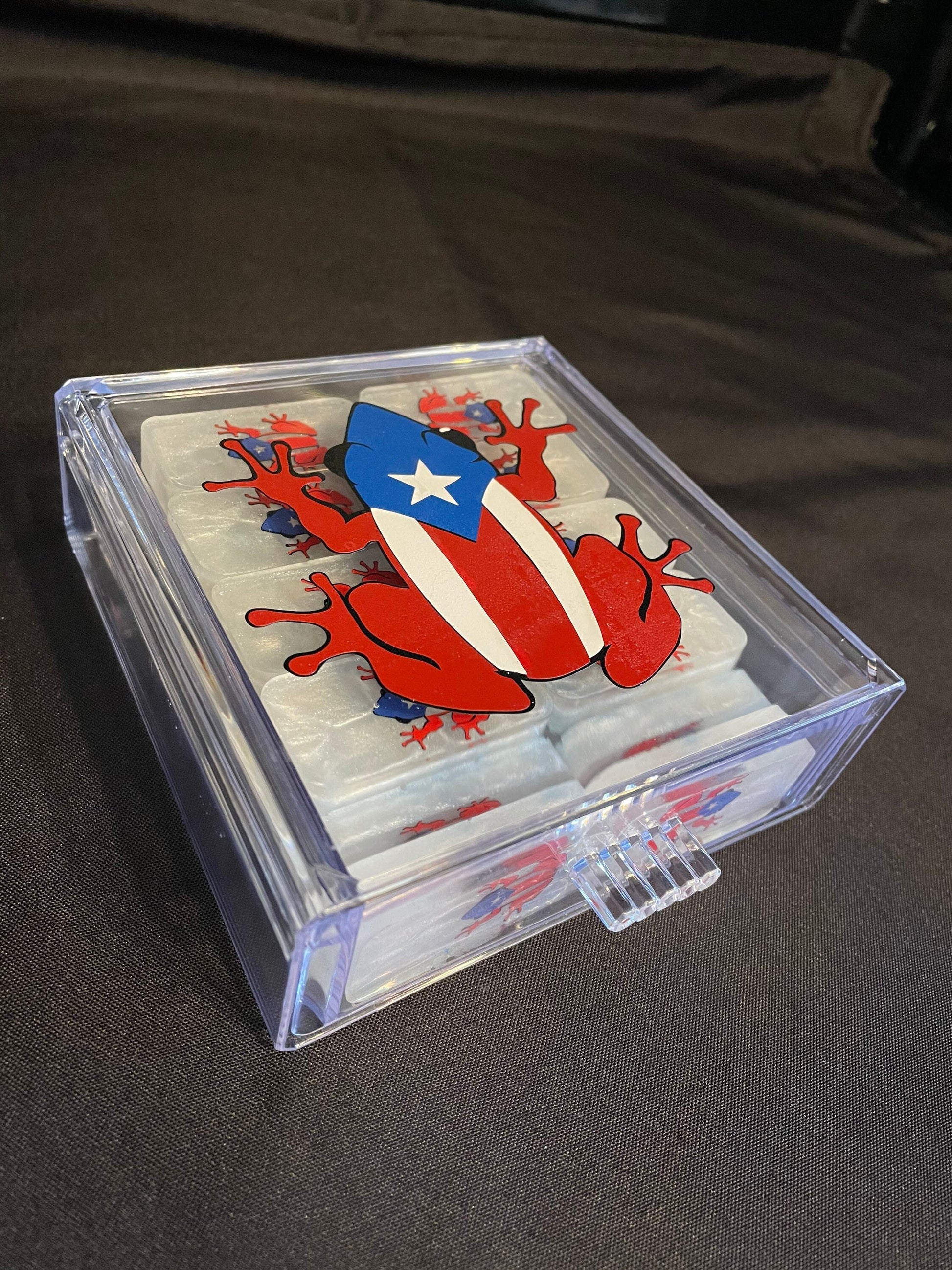 White set of Coqui dominoes closed in the case showing the design on the case