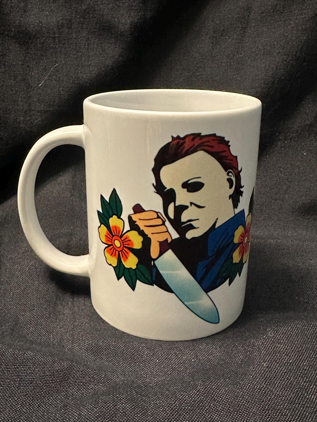 Michael Myers with a knife ready to stab with american traditional flowers around