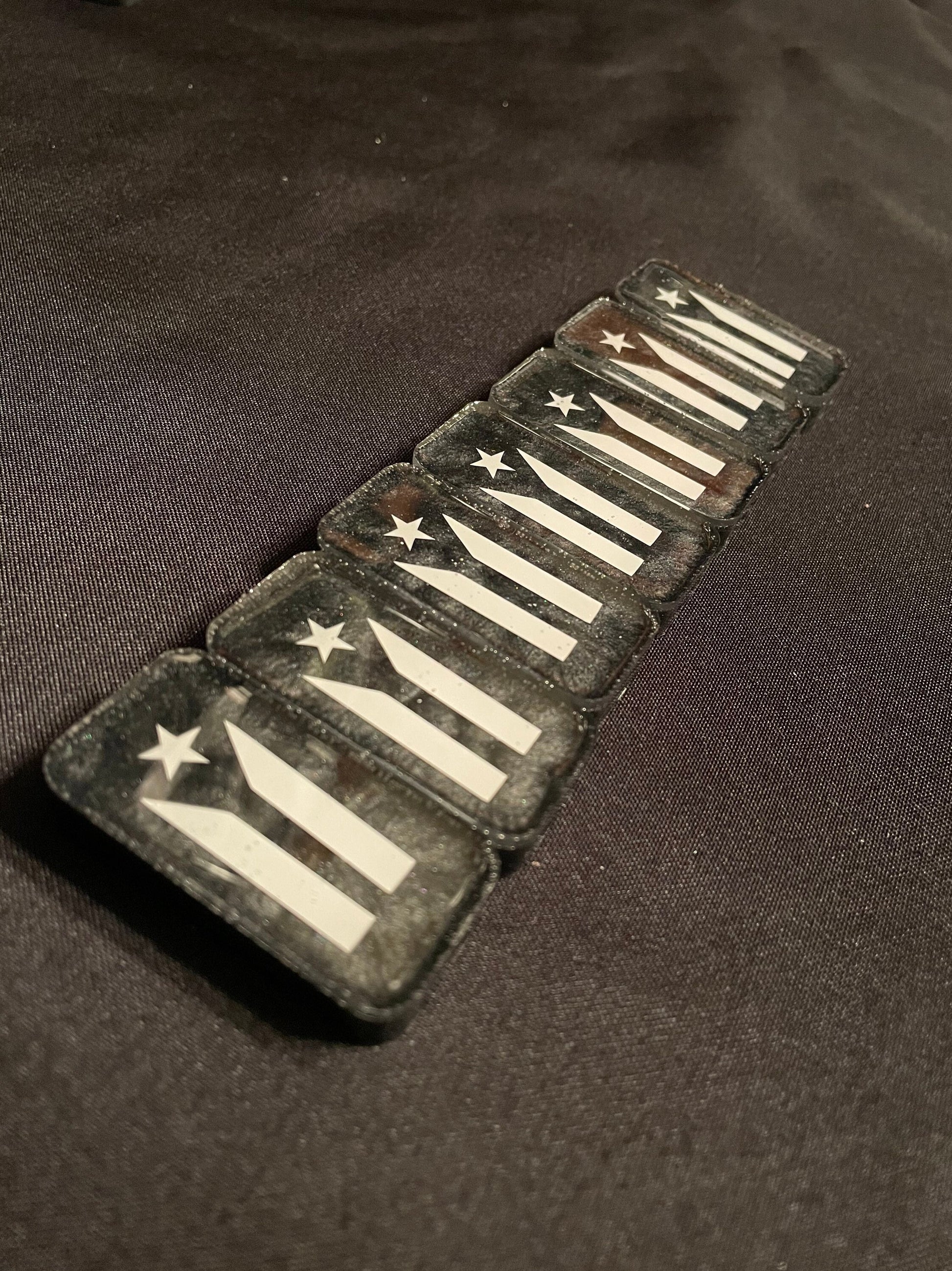 Puerto Rico Resistance Dominoes showing the design of the resistance flag on the back of the dominoes
