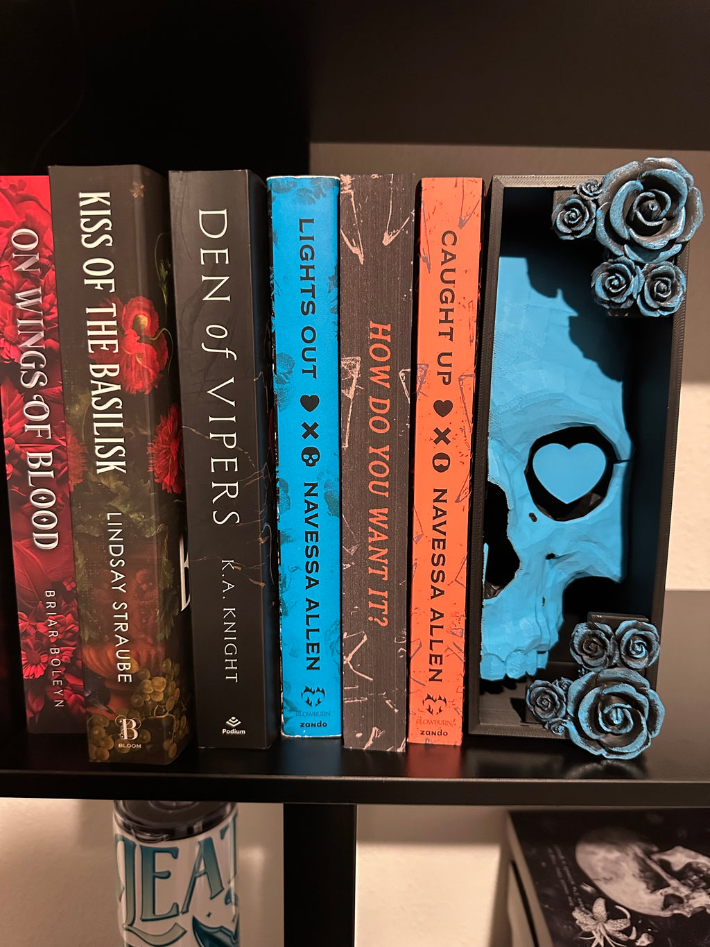Right side (Heart) holding books on a bookshelf