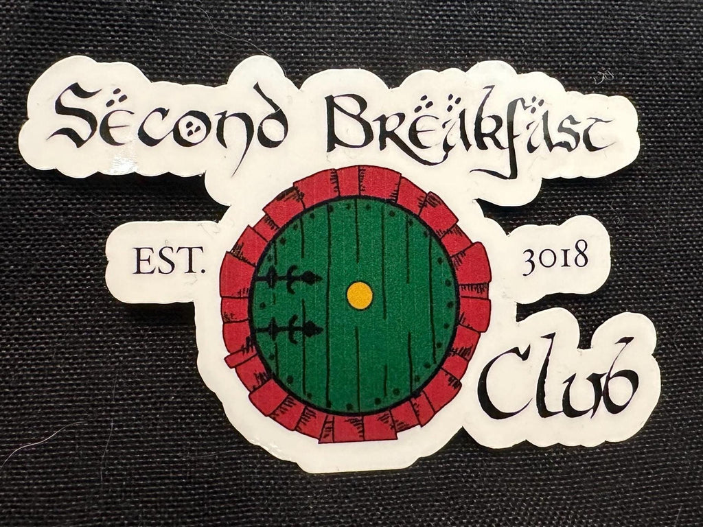 Closeup of the Second Breakfast Club sticker in the door edition