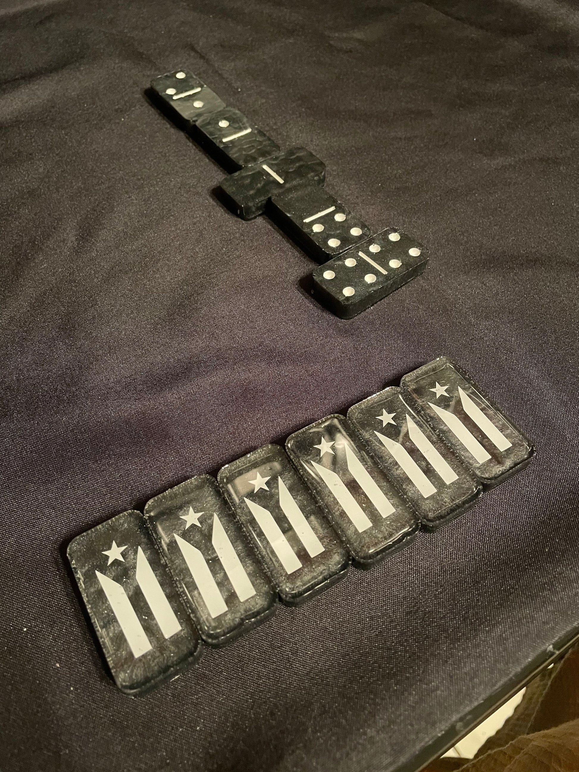 Top down view of the dominoes showcasing the resistance flag and the white dots and lines