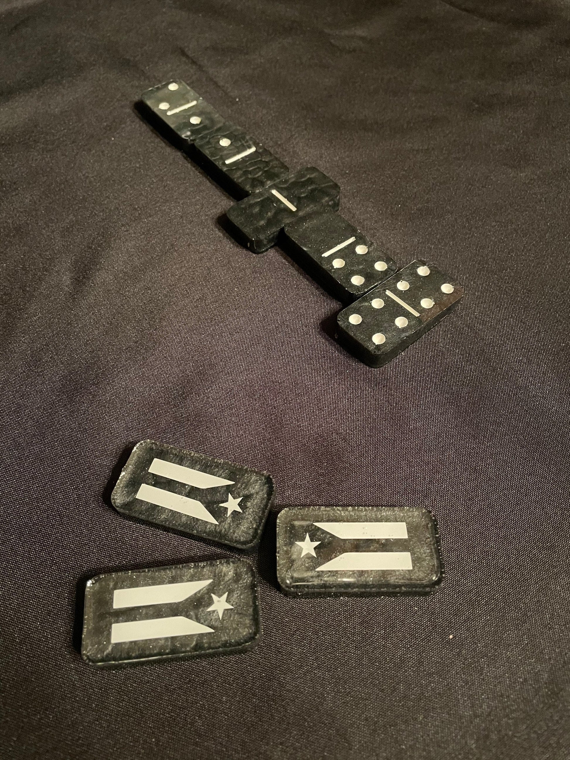 Top down view of the dominoes showcasing the resistance flag and the white dots and lines